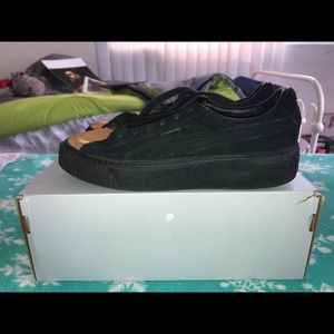 black and gold platform pumas